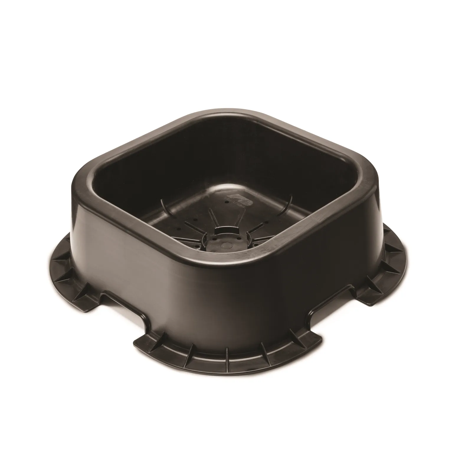 Black K&D mineral block feeder, three-quarter view showing the square tub, the flat base flange with notches, and the drain holes in the floor